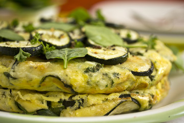 Tortilla with courgettes and spinach leaves