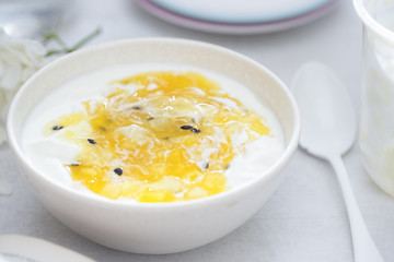 Yoghurt with mango and passion fruit compote