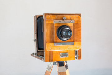 Old vintage big studio camera made of wood and metal on white background close up