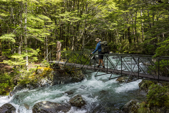 Man crossing creek, Travers Sabine Circuit, Nelson Lakes National Park, New Zealand