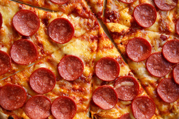 Pepperoni pizza. Hot homemade food. Sliced fresh italian classic salami pizza. Popular topping with cheese. Baked meal.