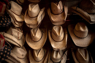 Rack of straw cowboy hats