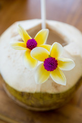 Fresh coconut beverage with flowers