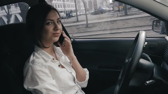Close up of businesswoman in the car making a phone call