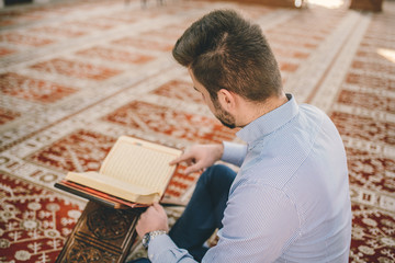 Fototapeta na wymiar Muslim reading from honorable koran