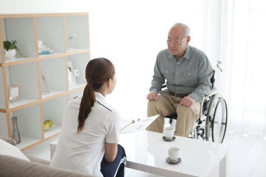 Nurse Talking To Senior Male Patient
