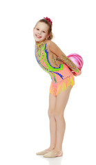 Gymnast does exercises with a ball