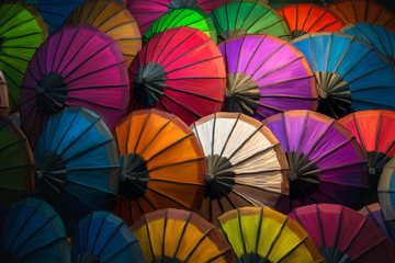 Fototapeta na wymiar Painting of colorful parasols at Luang Prabang Market