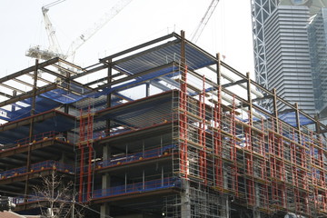 Unfinished steel frame building at a construction site 
