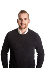 Handsome blonde man standing against a white background wearing a black sweater with a white shirt underneath. Standing against a white background.