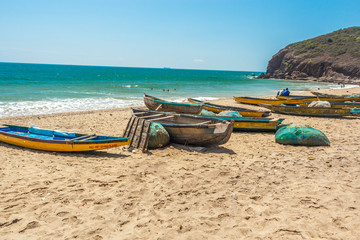 Obraz premium Wide view of group of fishing boats parked in seashore with sea background, Visakhapatnam, Andhra Pradesh, March 05 2017