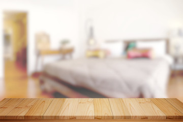 Product Display Concept. Empty top wood table and blurred bed room background. for Procuct display montage.