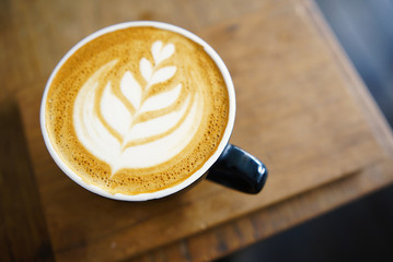 Hot coffee on wooden table. coffee Latte art