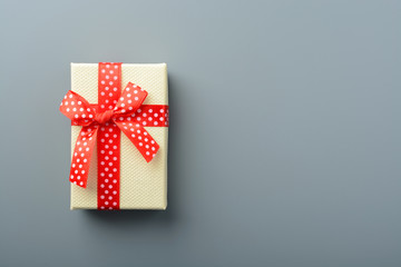 Gift box with red ribbon and bow