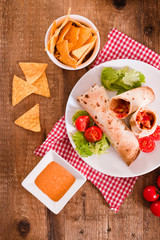 Tortilla wraps with chicken and vegetable. 
