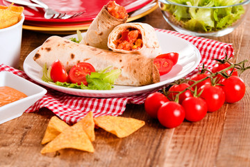 Tortilla wraps with chicken and vegetable. 