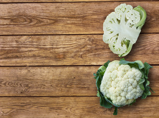 Green cut Organic cauliflower cabbage on wooden background