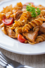 tasty pasta Fusilli with sausage for meal