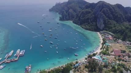 Aerial drone photo of Tonsai pier and iconic tropical beach and resorts of Phi Phi island, Thailand