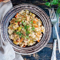 Brown rice with vegetables (broccoli, zucchini, carrots, onions) and champignons, square