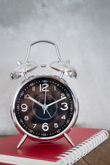 Alarm Clock On Wooden Work Table