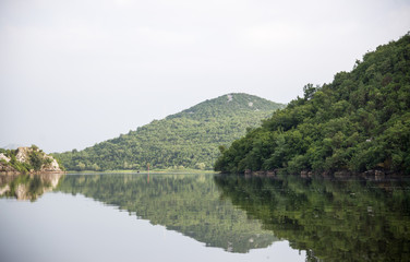 Fototapeta na wymiar Quiet waters of Lake Skadar in Montenegro