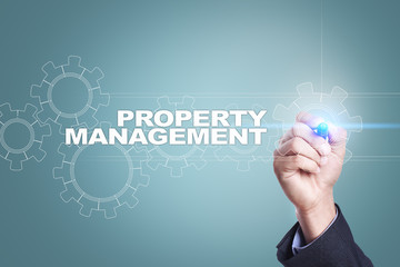 Fototapeta premium Businessman drawing on virtual screen. property management concept.