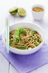 Sesame spaghetti with pea and scallions