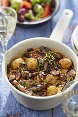 Roasted baby potatoes in creamy mushroom sauce