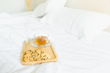 Fototapeta na wymiar Breakfast in bed with cookies and coffee