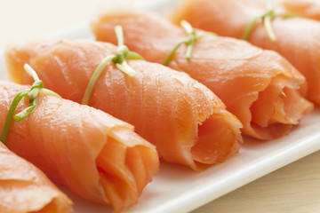 Rolls of smoked salmon as a snack