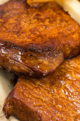 Closeup macro baked pork chops on the plate