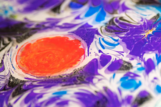 Purple and orange drawing in the ebru technique