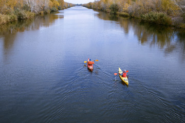 Traveling by kayak on the river on a sunny day.