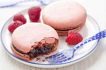 Raspberry macaroons with chocolate, raspberry and summer fruits centre