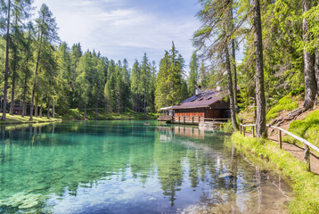 Obraz premium Beautiful lake in the middle of high peaks, Italian Dolomites