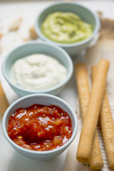 Tex mex - salsa, sour cream with chives and avocado dips served with bread sticks