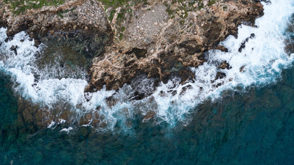 view of rough sea with rocks coast