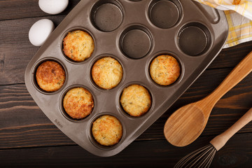 Muffins with cheese on dark wood backgroud