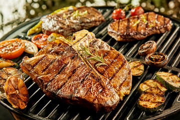 Selection of meat and vegetables on a barbecue