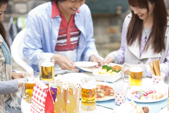 Young people eating at an outdoor cafe