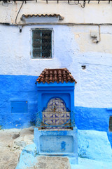 Public fountain on a street in Chefchaouen, Morocco