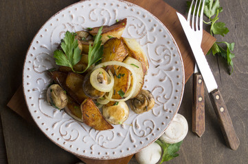 Fried potatoes with mushrooms, onions, parsley.