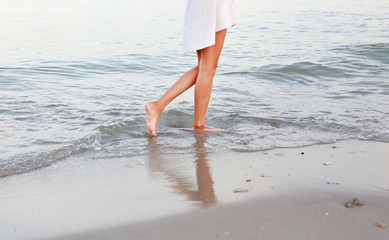 beach travel woman walking on sand beach