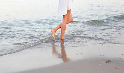 beach travel woman walking on sand beach