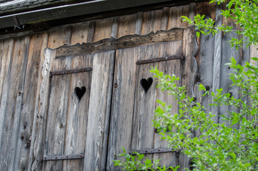 Old wooden windows frame on vintage house at Hallstatt village in the Austrian Alps at Salzkammergut region, Austria