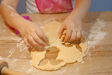 child making bunny shaped butter cookies for easter 