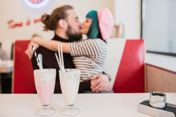 Couple Kissing at Diner Restaurant