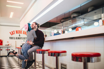 Couple Having Fun in Vintage Diner Bar