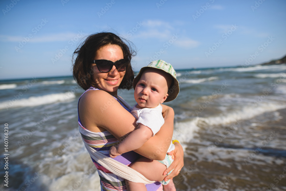 Wall mural smiling mother and cute child